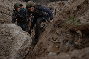 Trainees are seen in a training simulating an evacuation mission in the trench organised by the third separate assault brigade in Kyiv region. Ukraine is facing a shortage of ammunition and military personnel. Aside from a tougher mobilisation law is under way, some brigades in the country have chosen a more encouraging approach to recruit people without previous military experience to join the army. The third separate assault brigade offers a 7-day free training course advertises to allow participants to have a taste of military training, enabling them to find their place in the army according to their skills and ability. Participants here are as young as 18 years old. 

When the war between Ukraine and Russia grind on for the second year mark, Ukraine president Volodymyr Zelensky revealed in last December the military wants to mobilise an extra 500,000 people.