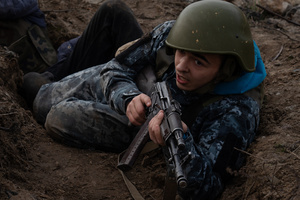A trainee is seen during a training simulating an evacuation mission in the trench organised by the third separate assault brigade in Kyiv region. Ukraine is facing a shortage of ammunition and military personnel. Aside from a tougher mobilisation law is under way, some brigades in the country have chosen a more encouraging approach to recruit people without previous military experience to join the army. The third separate assault brigade offers a 7-day free training course advertises to allow participants to have a taste of military training, enabling them to find their place in the army according to their skills and ability. Participants here are as young as 18 years old. 

When the war between Ukraine and Russia grind on for the second year mark, Ukraine president Volodymyr Zelensky revealed in last December the military wants to mobilise an extra 500,000 people.