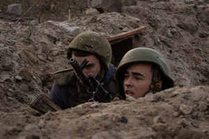 Trainees react during a training simulating an evacuation mission in the trench organised by the third separate assault brigade in Kyiv region. Ukraine is facing a shortage of ammunition and military personnel. Aside from a tougher mobilisation law is under way, some brigades in the country have chosen a more encouraging approach to recruit people without previous military experience to join the army. The third separate assault brigade offers a 7-day free training course advertises to allow participants to have a taste of military training, enabling them to find their place in the army according to their skills and ability. Participants here are as young as 18 years old. 

When the war between Ukraine and Russia grind on for the second year mark, Ukraine president Volodymyr Zelensky revealed in last December the military wants to mobilise an extra 500,000 people.