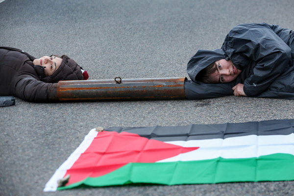 Activists from Palestine Action attach themselves to a metal lock-on and use their bodies to block the main vehicular access road into Instro Precision. Instro Precision provide components for Elbit System's weaponry. Palestine Action continues to target subsidiary companies of Israeli arms company Elbit Systems in an attempt to isolate them and make business impossible. This tactic has caused two of Elbit’s ten main businesses to close in the UK and several partner companies to cut ties with them.
