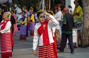 A Thai performer wearing traditional costumes waits to performs Thai Lanna dance during the 728th anniversary celebrations of Chiang Mai city. The city of Chiang Mai was founded by The three kings: King Mangrai, King Ngam Mueang and King Ram Khamhaeng on 12 April 1296.