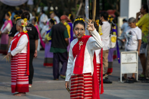 A Thai performer wearing traditional costumes waits to performs Thai Lanna dance during the 728th anniversary celebrations of Chiang Mai city. The city of Chiang Mai was founded by The three kings: King Mangrai, King Ngam Mueang and King Ram Khamhaeng on 12 April 1296.