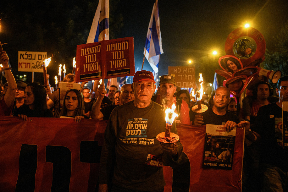 Families of the Israeli hostages march with torches and photos of their loved ones. Thousands of Israelis gathered around the Knesset to protest against Prime Minister Benjamin Netanyahu, followed by a torch march led by the hostage's families to PM Netanyahu’s residency in Azza Street demanding an immediate hostage deal and general elections. Clashes with the Israeli police occurred around the police barrier around Netanyahu’s house. Five were arrested, including one protestor who laid below a police skunk water cannon, preventing it from operating.