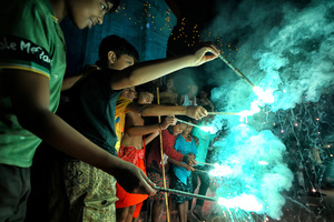 Fire crackers seen getting busted by the young boys during the annual Gajan Festival at Rudradev Temple of Murshidabad. Gajan is a Hindu festival celebrated mostly in the rural part of West Bengal. The festival is related to Lord Shiva and as per Mythology on the last day of Bengali Calendar (Middle of April) devotees used to worship dead bodies to satisfy Lord Shiva for better rain and harvest. The central theme of this festival is deriving satisfaction through non-sexual pain, devotion and sacrifice.