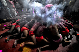 Hindu devotees are seen praying to their almighty during the annual Gajan Festival at Rudradev Temple of Murshidabad. Gajan is a Hindu festival celebrated mostly in the rural part of West Bengal. The festival is related to Lord Shiva and as per Mythology on the last day of Bengali Calendar (Middle of April) devotees used to worship dead bodies to satisfy Lord Shiva for better rain and harvest. The central theme of this festival is deriving satisfaction through non-sexual pain, devotion and sacrifice.