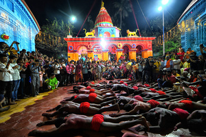 Hindu devotees are seen praying to their almighty before taking part in the annual Gajan Festival at Rudradev Temple of Murshidabad. Gajan is a Hindu festival celebrated mostly in the rural part of West Bengal. The festival is related to Lord Shiva and as per Mythology on the last day of Bengali Calendar (Middle of April) devotees used to worship dead bodies to satisfy Lord Shiva for better rain and harvest. The central theme of this festival is deriving satisfaction through non-sexual pain, devotion and sacrifice.