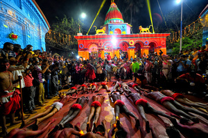 Hindu devotees lie on the ground before taking part in the annual Gajan Festival at Rudradev Temple of Murshidabad. Gajan is a Hindu festival celebrated mostly in the rural part of West Bengal. The festival is related to Lord Shiva and as per Mythology on the last day of Bengali Calendar (Middle of April) devotees used to worship dead bodies to satisfy Lord Shiva for better rain and harvest. The central theme of this festival is deriving satisfaction through non-sexual pain, devotion and sacrifice.