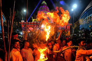 Hindu devotees seen playing with Fire during the Gajan Festival at Rudradev Temple of Murshidabad. Gajan is a Hindu festival celebrated mostly in the rural part of West Bengal. The festival is related to Lord Shiva and as per Mythology on the last day of Bengali Calendar (Middle of April) devotees used to worship dead bodies to satisfy Lord Shiva for better rain and harvest. The central theme of this festival is deriving satisfaction through non-sexual pain, devotion and sacrifice.