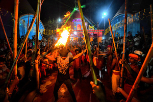 Hindu devotees seen playing with Fire during the Gajan Festival at Rudradev Temple of Murshidabad. Gajan is a Hindu festival celebrated mostly in the rural part of West Bengal. The festival is related to Lord Shiva and as per Mythology on the last day of Bengali Calendar (Middle of April) devotees used to worship dead bodies to satisfy Lord Shiva for better rain and harvest. The central theme of this festival is deriving satisfaction through non-sexual pain, devotion and sacrifice.