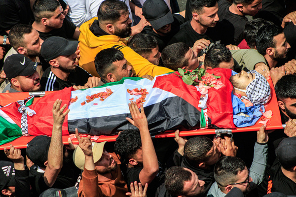 (EDITOR'S NOTE: Image depicts death)
Mourners carry the body of 17-year-old Palestinian student Yazan Muhammad Fawzi Shtayyeh, who was fatally shot by Israeli forces during a raid to apprehend wanted individuals, in the city of Nablus in the northern occupied West Bank.