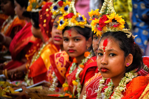 Young girls are seen participating in the Kumari Puja at the Adyapith temple. Kumari Puja is an Indian Hindu tradition primarily celebrated during Durga Puja according to the Hindu calendar. "Kumari" refers to a young virgin girl aged 1 to 16 who is worshipped by her mothers, according to Hindu mythology. It is believed that Kumari Puja bestows numerous blessings upon both the worshipers and the young girl. Devotees believe that the goddess will assist them in overcoming life's dangers and empower them to cope with stress and obstacles.