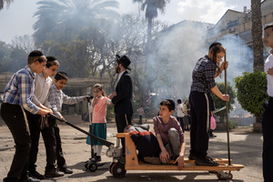 Children play during the Biur Chametz. During the Biur Chametz, religious Jews fulfill their obligation to inspect their homes for any leaven and eliminate it before the night of Passover. In ultra-Orthodox cities in Israel, fires are set up in major locations in the city for this purpose, where people bring their bread leftovers to burn the leaven. During the seven days of Passover, they are prohibited from eating or possessing any leaven, symbolizing the dough the Israelites did not have time to allow to rise before the Exodus from Egypt. Biur Chametz, also known as 'the burning of the leavened goods,' is a Jewish ceremonial ritual involving the burning of leavened foods (chamets) to mark the start of Passover.