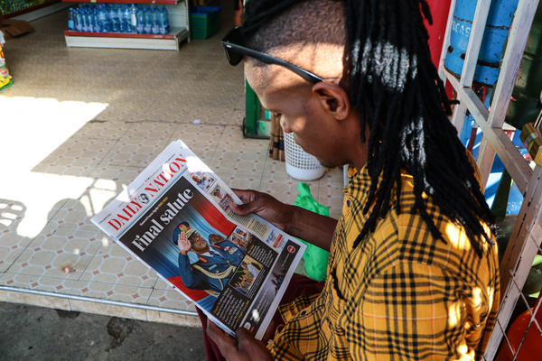 A man reads a Kenyan newspaper featuring the death of Chief of Defense Forces, General Francis Ogolla, who lost his life along with nine others in a military helicopter crash in Elgeiyo Marakwet, located approximately 400km Northwest of Nairobi. 
President William Ruto has declared three days of national mourning following the accident, and the flags will be flown at half-mast.