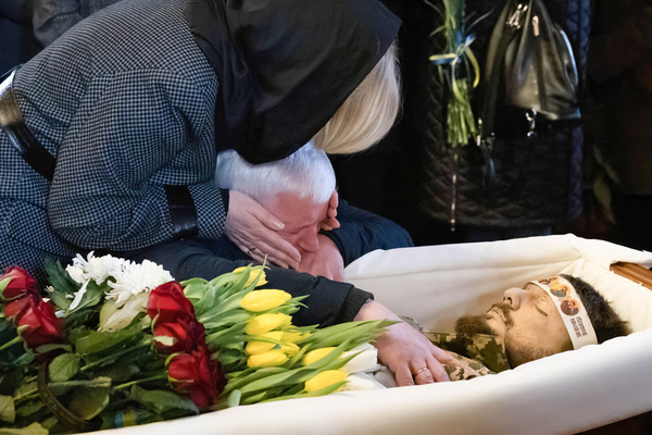 (EDITORS NOTE: Image depicts death)
Parents of the deceased mourn over a coffin with the body of Ukrainian serviceman and public figure Pavlo Petrychenko, who was killed in a fight against Russian troops in Eastern Ukraine, during a funeral service at St. Michael's Cathedral in Kyiv.