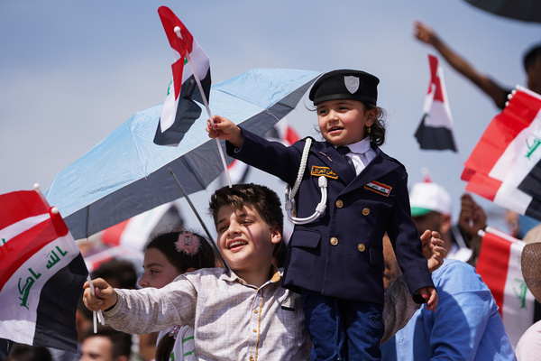 Children hold Iraqi flags during Spring Festival activities in the celebration area in the city of Mosul, northern Iraq. The festival is being held for the second year in a row since it stopped for two decades after 2003 due to the US invasion in Iraq. Spring celebrations go back to the era of the Assyrians, who celebrated the spring season and the beginning of the Assyrian year Akitu.