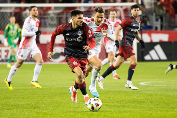 Raoul Petretta #28 (L) of Toronto and Giacomo Vrioni #9 (R) of New England Revolution in action during the MLS game between Toronto FC and New England Revolution at BMO field in Toronto. Final score: Toronto FC 1:0 New England Revolution