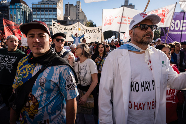 Two men protesters are seen during the rally. Hundreds of thousands of students, teachers, and workers mobilize in defense of public education in Argentina to protest the defunding of national universities. These universities are expected to operate in 2024 with the same budget as in 2023, despite facing an inflation rate of over 280%.