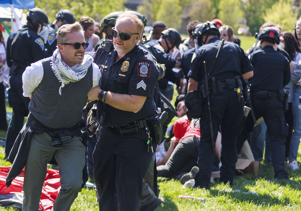 Dozens of people are arrested by the Indiana State Police riot squad during a pro-Palestinian protest on campus. The protesters had set up a tent camp in Dunn Meadow at 11 a.m. and police told them to take down the tents, or they would clear the area by force and arrest anybody who didn't leave. All the arrested protesters, including professors, have been banned from Indiana University's campus for a year.