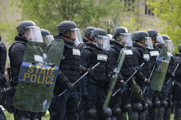 Police in formation near the Indiana Memorial Union in Dunn Meadow where activists were arrested on the third day of a pro-Palestinian protest camp in Dunn Meadow at Indiana University. The protesters refused to take down the tents, so the Indiana State Police swat team forced them from the camp, and arrested 23.