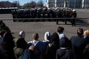 Spectators stand at the fence during a rehearsal for the May 9 Victory Parade on Palace Square.