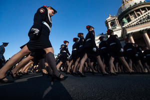 Ministry of Internal Affairs female cadets are seen after a rehearsal for the May 9 Victory Parade on Palace Square pass by St. Isaac's Cathedral.