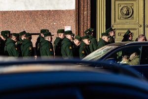 Russian military personnel stand at the pedestrian crossing after the rehearsal for the May 9 Victory Parade on Palace Square.