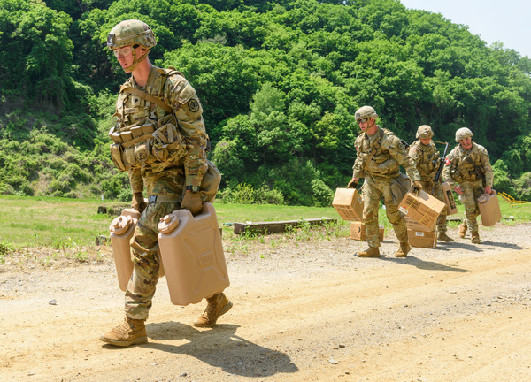 US soldiers carry water containers and MRE boxes during a stress shoot test of the Best Squad Competition conducted by the US 2nd Infantry Division and the ROK-US Combined Division at the US Army's Camp Casey in Dongducheon. The US 2nd Infantry Division based in South Korea holds a 'Best Squad Competition' where soldiers compete in a variety of events testing them both physically and mentally.