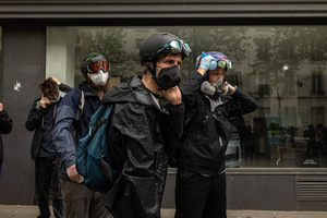 A group of demonstrators seen wearing protective goggles and gas masks to protect themselves from the anti-riot tear gas during the labour day demonstrations. A day full of clashes between the black-block, anarchists and anti-capitalists groups, with the police became the norm on the celebration of the 1st of May - Labour day in Paris, as demonstrators complaining about president Macron's government and his political and social law changes.