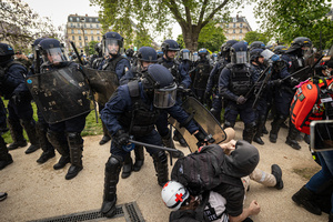 A riot police from the CRS unit of Paris seen detaining a protestor during the labour day demonstrations. A day full of clashes between the black-block, anarchists and anti-capitalists groups, with the police became the norm on the celebration of the 1st of May - Labour day in Paris, as demonstrators complaining about president Macron's government and his political and social law changes.