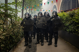 Riot police officers of the Gendarmerie unit form up after throwing tear gas to disperse the protestors during the labour day demonstrations. A day full of clashes between the black-block, anarchists and anti-capitalists groups, with the police became the norm on the celebration of the 1st of May - Labour day in Paris, as demonstrators complaining about president Macron's government and his political and social law changes.
