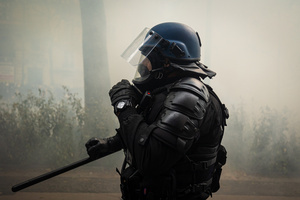 A riot police from the Gendarmerie unit is seen amidst a cloud of tear gas during the labour day demonstrations. A day full of clashes between the black-block, anarchists and anti-capitalists groups, with the police became the norm on the celebration of the 1st of May - Labour day in Paris, as demonstrators complaining about president Macron's government and his political and social law changes.