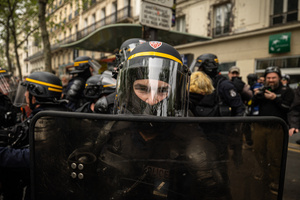 A riot police from the CRS of Paris seen in a defensive position during the labour day demonstrations. A day full of clashes between the black-block, anarchists and anti-capitalists groups, with the police became the norm on the celebration of the 1st of May - Labour day in Paris, as demonstrators complaining about president Macron's government and his political and social law changes.