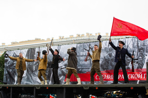 Participants in an interactive show dressed in Great Patriotic War clothing with the Soviet flag during the passage of military equipment of the Russian Armed Forces on Palace Square during the general rehearsal of the Victory Parade. On May 9, 2024, Russia will celebrate Victory Day in the Great Patriotic War for the 79th time. The parade of troops of the territorial garrison of St. Petersburg will begin on the morning of May 9. 78 units of military equipment (including seven from the war era) will pass through Palace Square. After this, about 4,500 parade participants will march in front of the podium with veterans and other honored guests of the holiday, 3,000 of them from the Ministry of Defense. It is known that 350 WWII veterans will take part in the parade.