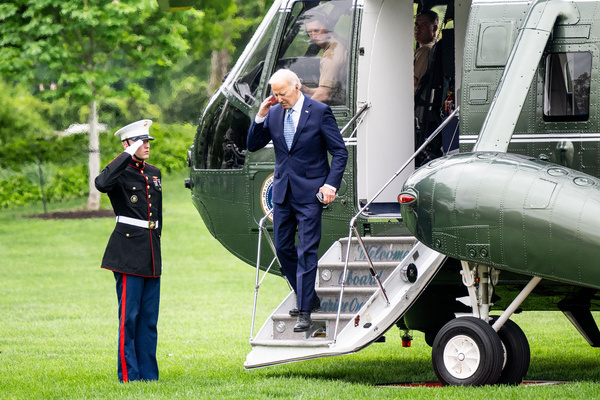 President Joe Biden saluting a Marine as he returns to the White House in Washington, DC.