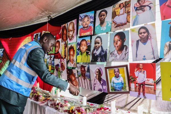 A volunteer lights up a candle beneath portraits of the people that lost their lives during the Maai Mahiu floods tragedy are displayed on a wall during an interdenominational prayer and mass funeral service in Maai Mahiu. Heavy rainfall in Kenya led to mudslides and floods that caused loss of lives and widespread destruction of property. The government of Kenya declared May 9, 2024 a National Holiday to remember those who died in the floods.