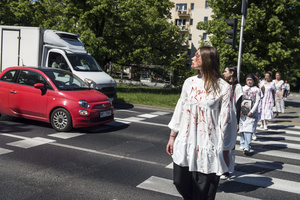 Ukrainian activists covered with fake blood walk at a crossing trying to slow down the traffic and the car of Russia's ambassador near the cemetery to Red Army soldiers. On Russia's "Victory Day", in Warsaw Russia's Ambassador to Poland, Sergey Andreev and his delegation laid a wreath at the monument at the cemetery to Red Army soldiers who died during World War II. During the ceremony Ukrainian activists tried to disturb the event. May 9th called as the "Victory Day" in Russia is a holiday commemorating the Soviet victory over Nazi Germany in 1945.