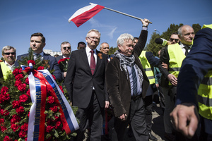 Russia's Ambassador to Poland, Sergey Andreev (middle) and his delegation surrounded with Polish supporters, walks at the cemetery to Red Army soldiers. On Russia's "Victory Day" in Warsaw Russia's Ambassador to Poland, Sergey Andreev and his delegation laid a wreath at the monument at the cemetery to Red Army soldiers who died during World War II. During the ceremony Ukrainian activists tried to disturb the event. May 9th, known as "Victory Day" in Russia, is a holiday commemorating the Soviet victory over Nazi Germany in 1945.