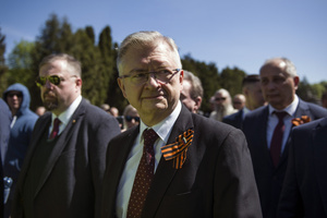 Russia's Ambassador to Poland, Sergey Andreev and his delegation surrounded with Polish supporters, walks at the cemetery to Red Army soldiers. On Russia's "Victory Day" in Warsaw Russia's Ambassador to Poland, Sergey Andreev and his delegation laid a wreath at the monument at the cemetery to Red Army soldiers who died during World War II. During the ceremony Ukrainian activists tried to disturb the event. May 9th, known as "Victory Day" in Russia, is a holiday commemorating the Soviet victory over Nazi Germany in 1945.