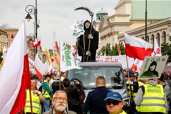 Protesters lead a model of the grim reaper as Solidarity organisation and Polish farmers protest with Polish and Solidarity flags and anti Green Deal banners at Royal Castle Square. The protest in Poland is part of the European farmers' protest against the EU's Green Deal regulations. Polish farmers also demand a change to the EU agreement with Ukraine regarding the import of agricultural produce to the EU. The protest gathered over 100 thousand people.