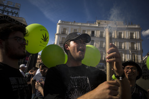 A protester releases smoke from a large joint, during a demonstration through the streets of Madrid, commemorating the World Marijuana March. Since 1999, every first Saturday in May the World Marijuana day is celebrated worldwide. Those who participated in the march demanded that marijuana should be legalized and ask that cultivation and possession not be criminalized.