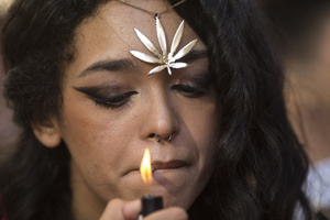 A protester lights a joint, during a demonstration through the streets of Madrid, commemorating the World Marijuana March. Since 1999, every first Saturday in May the World Marijuana day is celebrated worldwide. Those who participated in the march demanded that marijuana should be legalized and ask that cultivation and possession not be criminalized.