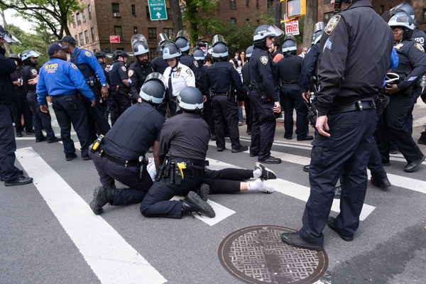 NYPD officers hold a protester down on then street as they arrest him during a demonstration. Pro-Palestine protesters gathered at the Barclay’s Center in Brooklyn to condemn Israel in the ongoing Israel-Hamas war in Gaza. Protesters flooded the streets of Brooklyn and made their way to the Manhattan Bridge. Numerous arrests were made.