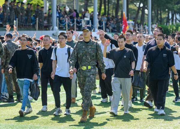 South Korean conscripts follow a drill instructor during their entrance ceremony to join the military service at the boot camp of the 55th Infantry Division in Yongin. Conscription in South Korea, managed by the Military Manpower Administration, has existed since 1957. South Korean law requires most able-bodied male citizens between the ages of 18 and 35 to perform compulsory military service. While women are not required to perform military service, they may voluntarily join the military.