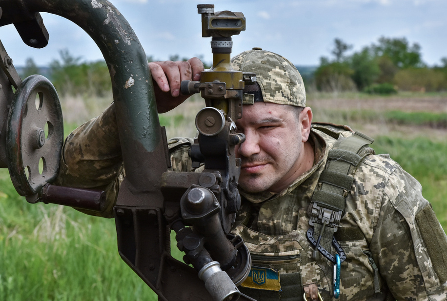 A Ukrainian serviceman of 65th Separate Mechanized brigade aims to fire a BM-21 “Grad” multiple rocket launcher towards Russian positions near the frontline in Zaporizhzhia region. The US 