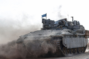 An Israeli tank operates amid the ongoing conflict between Israel and the Palestinian Islamist group Hamas. The movement of tanks, armored personnel carriers, trucks, and military jeeps belonging to the Israeli army continues along the border near Rafah, Gaza. At least 45 people, mostly women and children, were killed, and nearly 250 others were injured in an Israeli strike on the camp on Sunday.