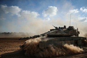 An Israeli tank operates amid the ongoing conflict between Israel and the Palestinian Islamist group Hamas. The movement of tanks, armored personnel carriers, trucks, and military jeeps belonging to the Israeli army continues along the border near Rafah, Gaza. At least 45 people, mostly women and children, were killed, and nearly 250 others were injured in an Israeli strike on the camp on Sunday.