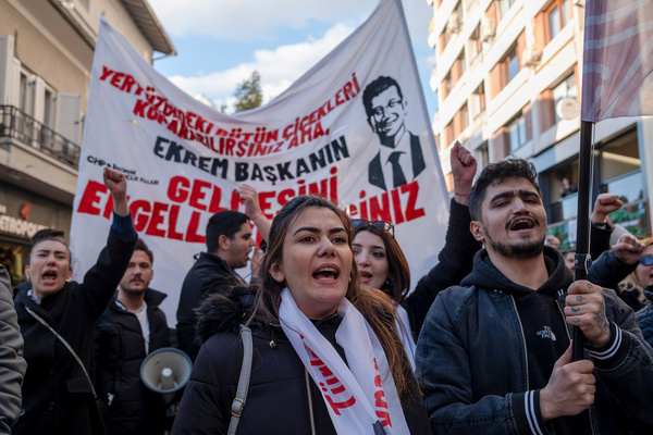 People chant slogans and hold banners during the march in support of Ekrem Imamoglu. Protesters gathered to show support for Ekrem İmamoğlu and oppose his detention. İmamoğlu, the mayor of Istanbul from the Republican People's Party (CHP), was detained along with dozens of his aides and party members on charges of corruption and leading a criminal organization. Calling the arrest a political conspiracy and a coup against democracy, the opposition took to the streets in multiple cities across Turkey to protest.