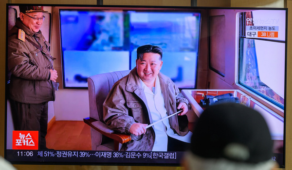 A man looks at a 24-hour Yonhap news TV broadcast at Seoul Railway Station showing a news broadcast with the North Korean leader Kim Jong Un smiling after a test-fire of the latest surface-to-air missile(SAM) at an undisclosed location in North Korea. North Korea has successfully test-fired its latest surface-to-air missile(SAM) system, which was recently put into full-scale production, as leader Kim Jong Un oversaw the test, state media reported on March 21.
The test-firing was conducted by the country's Missile Administration on Thursday to "examine the comprehensive performance" of the missile system being mass-produced at a munitions' industry enterprise, the Korean Central News Agency (KCNA) noted.

Kim oversaw the test alongside key members of the party's Central Military Commission, the KCNA said, claiming that it proved the anti-aircraft missile's combat fast response is "advantageous" and "highly reliable."