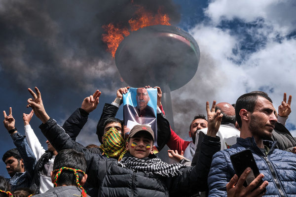 Young Kurds, holds a poster of jailed Kurdistan Workers' Party (PKK) militant group leader Abdullah Ocalan. Tens of thousands of people gathered in Diyarbakir to celebrate Newruz, also known as Noruz or Nevruz, which marks the new year according to the Persian calendar. Millions of people across the Middle East, Asia, and Eastern Europe are celebrating the Newruz festival, which signifies the arrival of spring.
