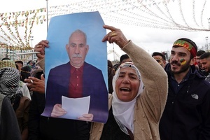 A female demonstrator holds a poster of Abdullah Ocalan, the leader of the Kurdish armed organization Kurdistan Workers' Party (PKK), and shouting slogans during the Newruz celebration. Tens of thousands gather at the Newroz Square in Diyarbakir, the largest Kurdish-majority city during the final celebration of the Newroz holiday. The massive crowd celebrated with great enthusiasm, marking the occasion with vibrant festivities. This celebration is observed by the Kurdish people in Turkey across 89 locations this year.